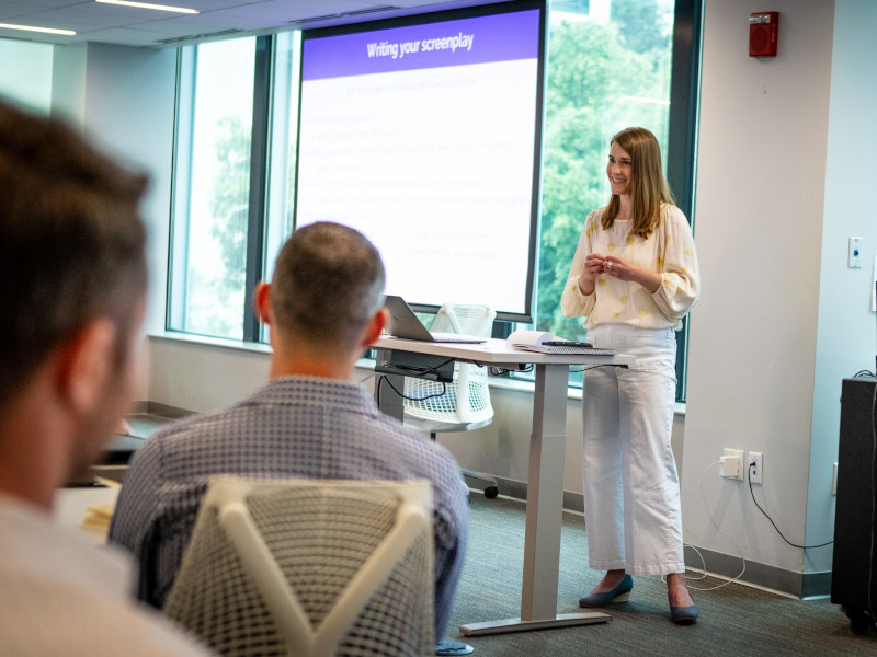 female conducting a presentation in a workshop