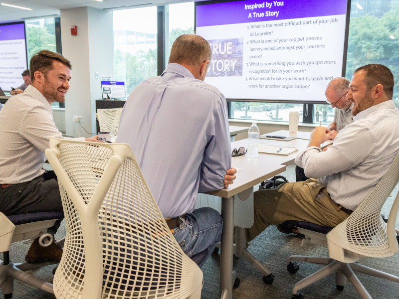 four workshop participants discussing topics